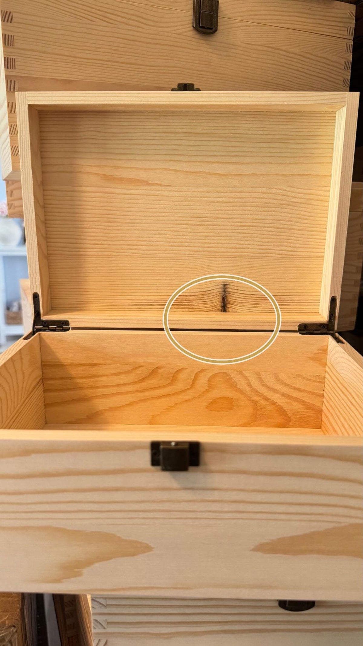 Inside view of wooden pet memory box showing natural wood grain and minor imperfections